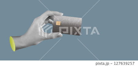 Bank card held in hand. Credit, debit, and ATM cards for smart, cashless payment and online shopping 127639257