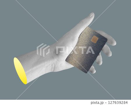 Bank card held in hand. Showing elegant, premium design with electronic chip for secure payment, Bank card held in hand. Showing elegant, premium design with electronic chip for secure payment, 127639284