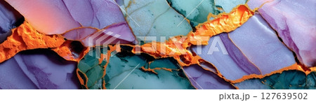 Semiprecious stone surface with vivid purple, green and orange veining in macro view 127639502