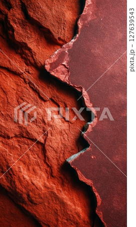 Red travertine stone texture with rough edge transition to polished dark surface in close-up Red travertine stone texture with rough edge transition to polished dark surface in close-up 127639543