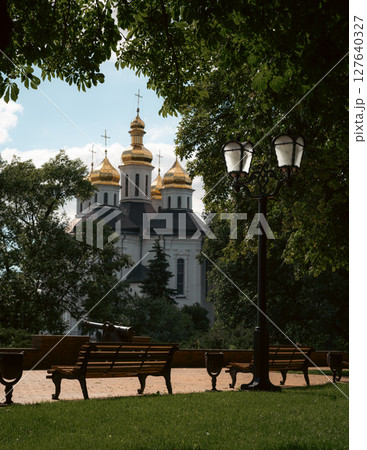 The peaceful park setting enhances the spiritual aura of the scene. The peaceful park setting enhances the spiritual aura of the scene. 127640327