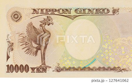 10000 yen banknote showing intricate details of phoenix, used in Japanese currency. 127641062