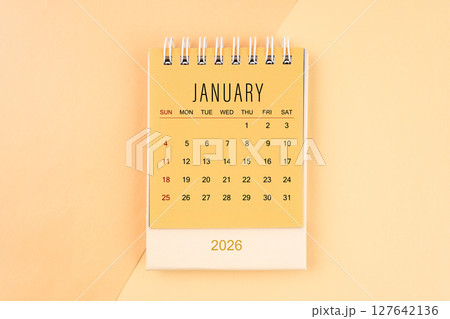 January 2026 mini desk calendar on the yellow, planning for business meeting concept. January 2026 mini desk calendar on the yellow, planning for business meeting concept. 127642136
