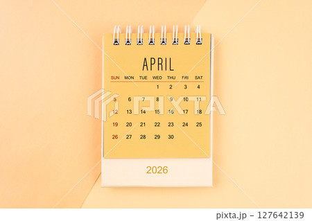 April 2026 mini desk calendar on the yellow, planning for business meeting concept. April 2026 mini desk calendar on the yellow, planning for business meeting concept. 127642139