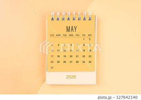 May 2026 mini desk calendar on the yellow, planning for business meeting concept. May 2026 mini desk calendar on the yellow, planning for business meeting concept. 127642140