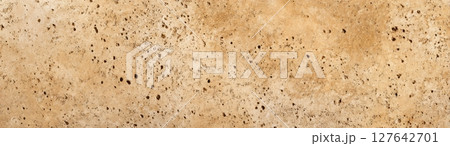Travertine stone texture in warm beige with dense porous surface, top-down image 127642701