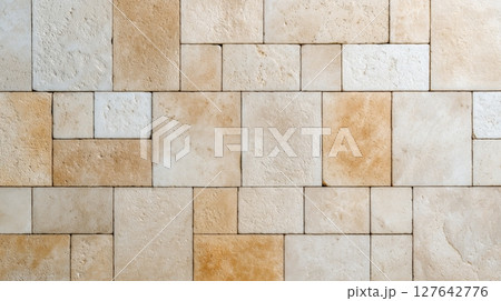 Beige travertine tiles in varied rectangular pattern with natural porous texture Beige travertine tiles in varied rectangular pattern with natural porous texture 127642776