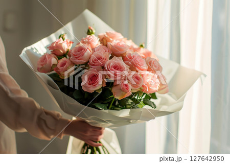 a woman holding a bouquet of roses.ai generative a woman holding a bouquet of roses.ai generative 127642950