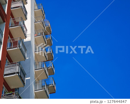 Modern residential building showing balconies and clear blue sky copy space Modern residential building showing balconies and clear blue sky copy space 127644847