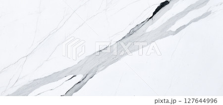 Statuario marble surface with dramatic grey veining, high-resolution closeup of premium white stone, luxury natural background for elegant modern interiors 127644996