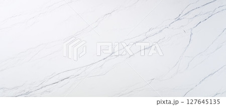 Statuario marble background with subtle gray vein network on white polished surface 127645135