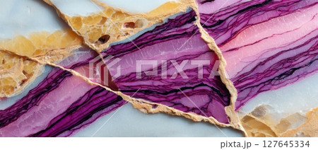 High contrast semiprecious mineral surface with purple line inclusions and yellow crystals 127645334