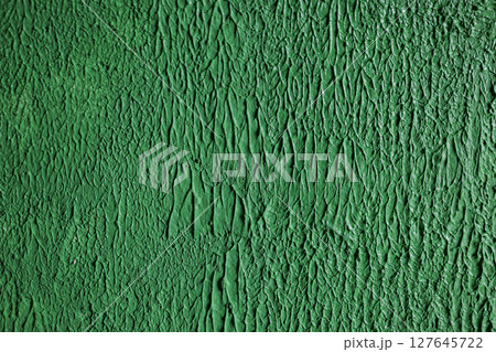 Close-up texture of rough green plaster. 127645722