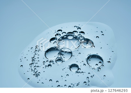 Delicious serum texture with bubbles on a blue background. 127646293