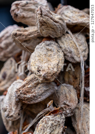 Dried persimmon fruits are sold at the market. Fruits Dried persimmon fruits are sold at the market. Fruits 127647053