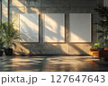 Stylish interior with blank posters on concrete wall and natural lighting 127647643