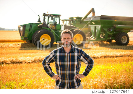 Farmer check wheat. Agricultural wheat at harvest time. Countryside crop. Agronomist man harvesting at crop field. Ripe agriculture. Harvest man at field. Farmer agronomist. Crop harvest. Rural man 127647644