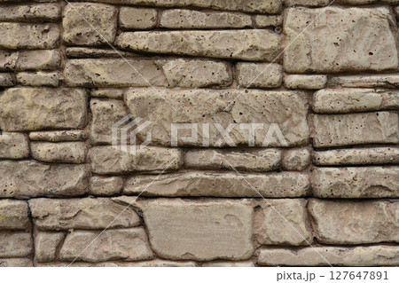 Background of decorative stone wall forming seamless texture 127647891