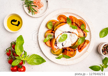 Caprese salad with burrata cheese Caprese salad with burrata cheese 127648251