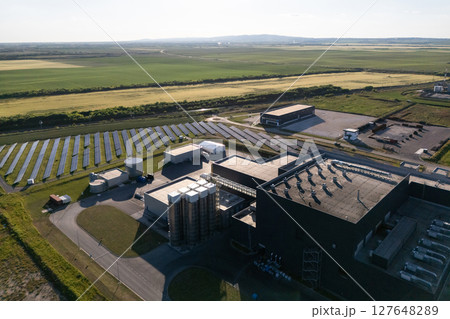 Modern green factory powered by renewable solar energy. Sustainable development in industry Modern green factory powered by renewable solar energy. Sustainable development in industry 127648289