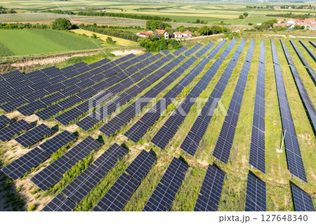 Aerial view of village next to solar power station Aerial view of village next to solar power station 127648340