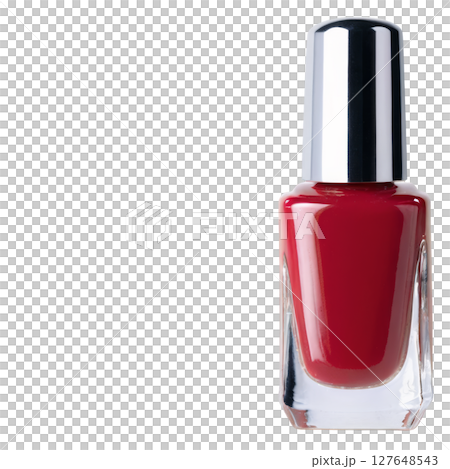 Bright red nail polish in a sleek bottle displayed on a clean surface Bright red nail polish in a sleek bottle displayed on a clean surface 127648543