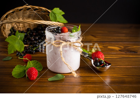 Berry ice cream with natural ingredients on wooden background Berry ice cream with natural ingredients on wooden background 127648746