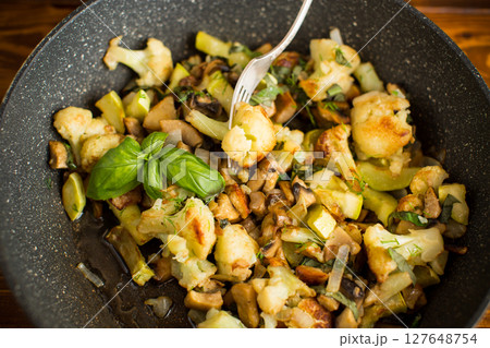Hot dish of cauliflower and champignons Hot dish of cauliflower and champignons 127648754