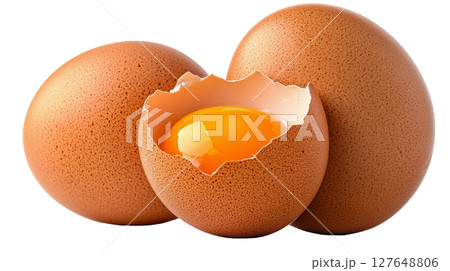 Fresh brown eggs with one cracked open revealing a bright yellow yolk on a white background Fresh brown eggs with one cracked open revealing a bright yellow yolk on a white background 127648806