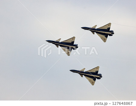 J-10 of China Air Force Aerobatics team on fly formations at airshow. J-10 of China Air Force Aerobatics team on fly formations at airshow. 127648867