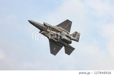 Lockheed Martin F-35A Lightning II Multirole strike fighter with weapon bay doors open at airshow 127648916