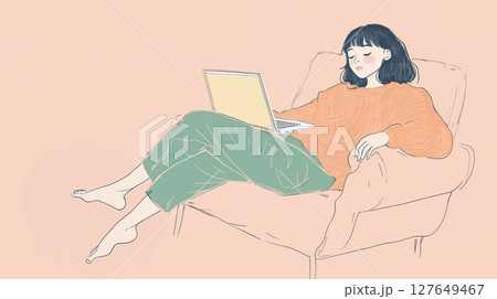 Young woman working on laptop in cozy chair during afternoon at home 127649467