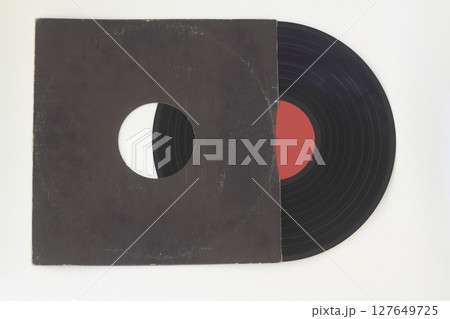 Aged black paper cover and vinyl record isolated on white background 127649725