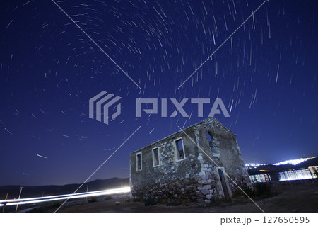 A view of the stars of the Milky Way with a mountain top in the foreground.Perseid Meteor Shower observation 127650595