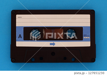 Vintage Cassette tape on a blue background with copy space Vintage Cassette tape on a blue background with copy space 127651230