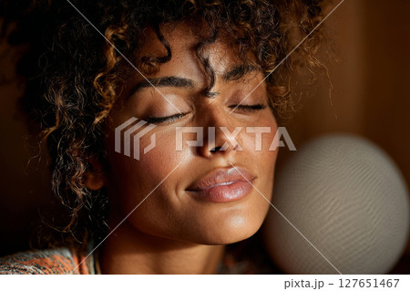 Peaceful female face with soft light and natural expression 127651467