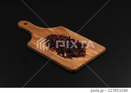 Hibiscus, a pile of red dried Hibiscus tea leaves. Karkade tea. On white background. View from above. 127653290