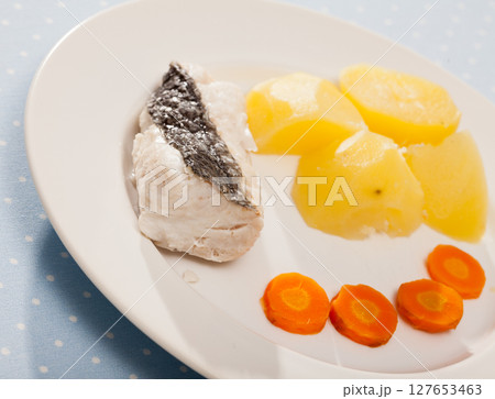 Steamed whiting with potato and carrots Steamed whiting with potato and carrots 127653463
