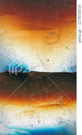 Fractured glass. Distressed overlay. Blue orange dust scratches dirt stains old film noise weathered effect broken texture on dark black grunge abstract background. Fractured glass. Distressed overlay. Blue orange dust scratches dirt stains old film noise weathered effect broken texture on dark black grunge abstract background. 127658810