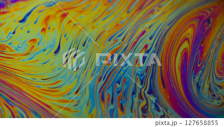 Drop ink. Gasoline art. Defocused blue yellow green colorful wet bubbles flowing liquid floating on abstract dark black background. Drop ink. Gasoline art. Defocused blue yellow green colorful wet bubbles flowing liquid floating on abstract dark black background. 127658855