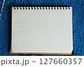 方眼紙のノート　薄い水色のグリッド入りのシンプルな背景素材 127660357