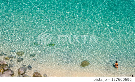 Tourist enjoying crystal clear water in Tropea, Calabria, Italy Tourist enjoying crystal clear water in Tropea, Calabria, Italy 127660696