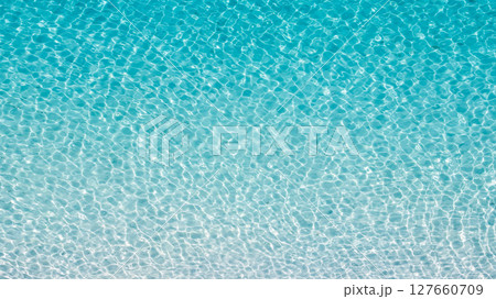 Crystal clear water gently reflecting sunlight in Tropea, Calabria, Italy 127660709