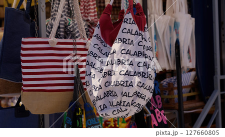 Colorful Souvenir Bags Hanging in Tropea, Calabria, Italy 127660805