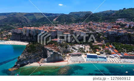 Tropea, Calabria, soaring over the picturesque coastline and turquoise waters Tropea, Calabria, soaring over the picturesque coastline and turquoise waters 127660912