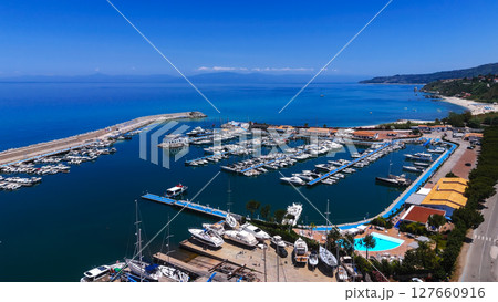 Tropea port with docked boats enjoying summer sunny day in Calabria, Italy Tropea port with docked boats enjoying summer sunny day in Calabria, Italy 127660916