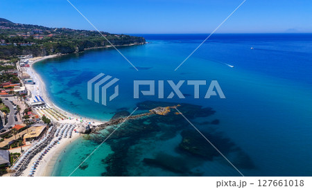 Aerial view of Tropea beach and coastline in Calabria, Italy, showing turquoise waters and white 127661018