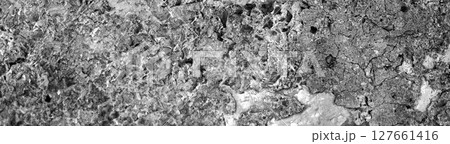 Close-up of volcanic stone wall with irregular surface, wide view. Close-up of volcanic stone wall with irregular surface, wide view. 127661416