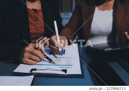 Business Documents, Auditor businesswoman checking searching document legal prepare paperwork or report for analysis TAX time,accountant Documents data contract partner deal in workplace office Business Documents, Auditor businesswoman checking searching document legal prepare paperwork or report for analysis TAX time,accountant Documents data contract partner deal in workplace office 127666213
