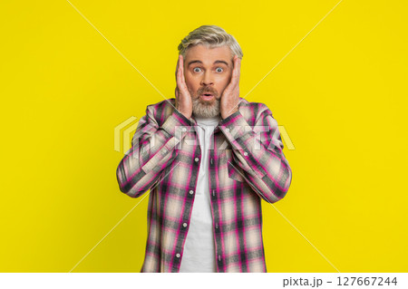 Excited amazed man surprise looking at camera with big eyes shocked by sudden victory wow emotion 127667244